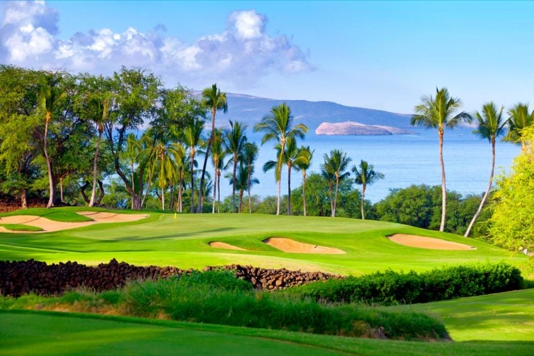 The eighth green is surrounded by large bunkers on the Gold Course at Wailea Beach Resort