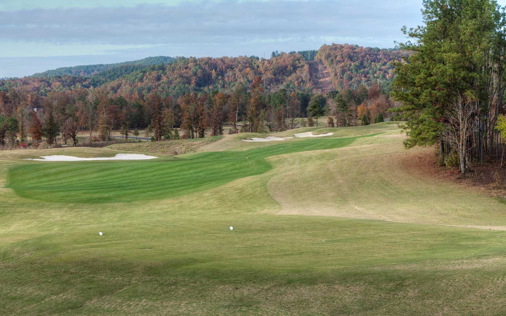 Rolling fairways with mountainous surrounds the Mindbreaker fifth hole