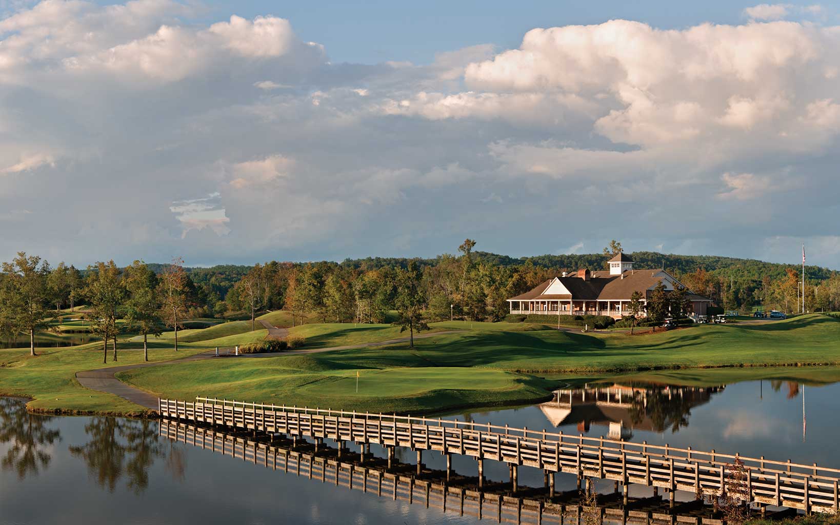 A wooden bridge allows golfers to cross the Heartbreaker eighth hole at Silver Lakes