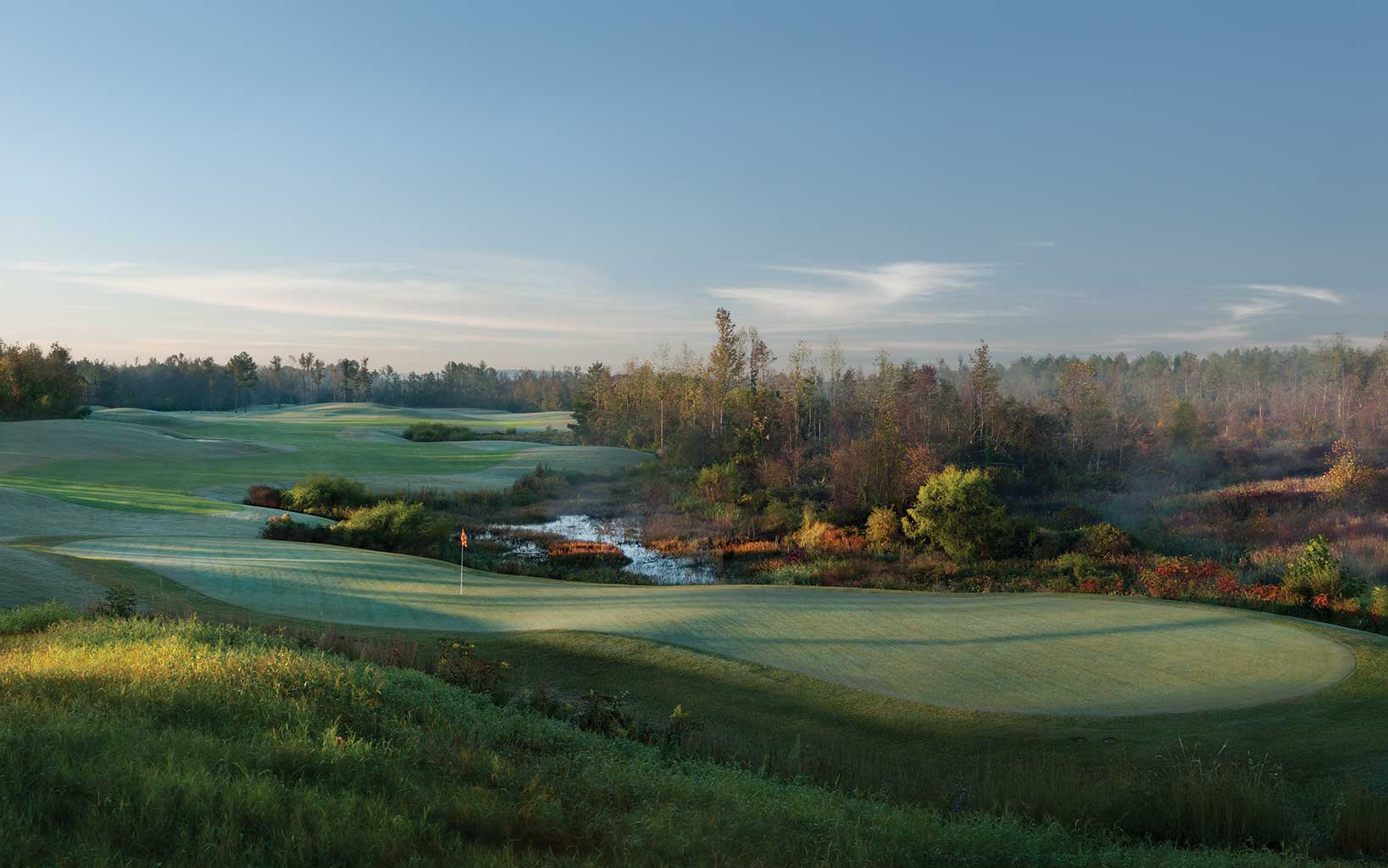 Early morning dew rests on the seventh green of the Backbreaker course at Silver Lakes