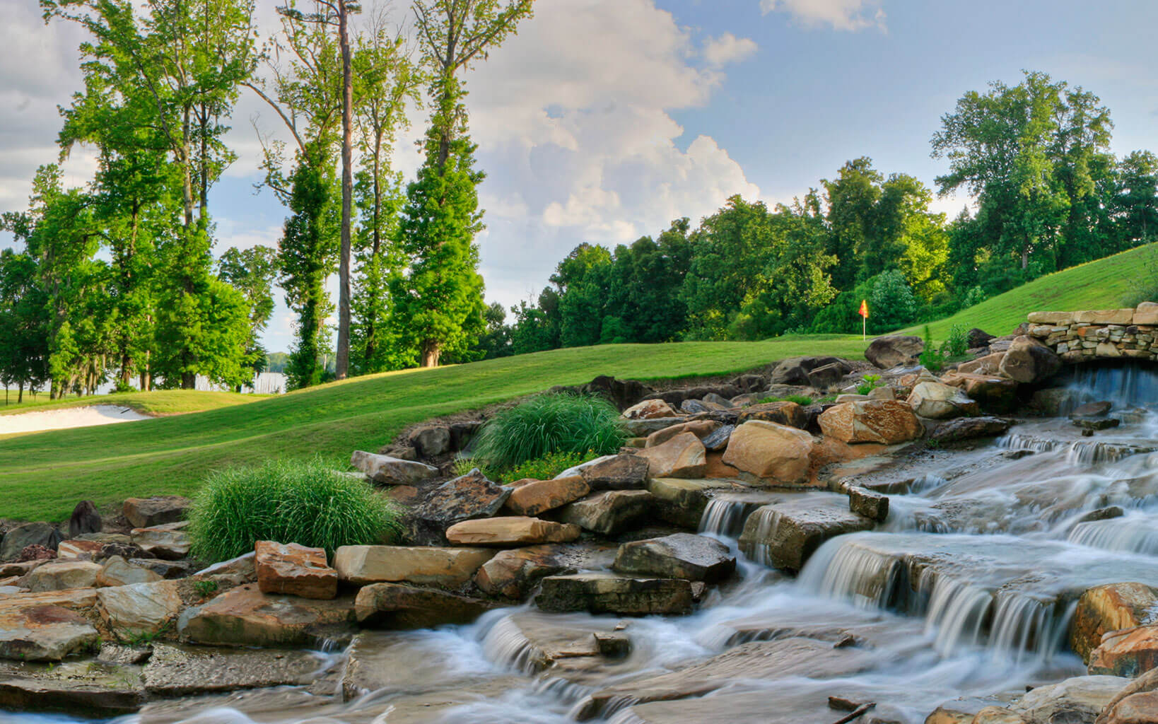 A cascading waterfall resides next to the green on Capitol Hill's Judge course