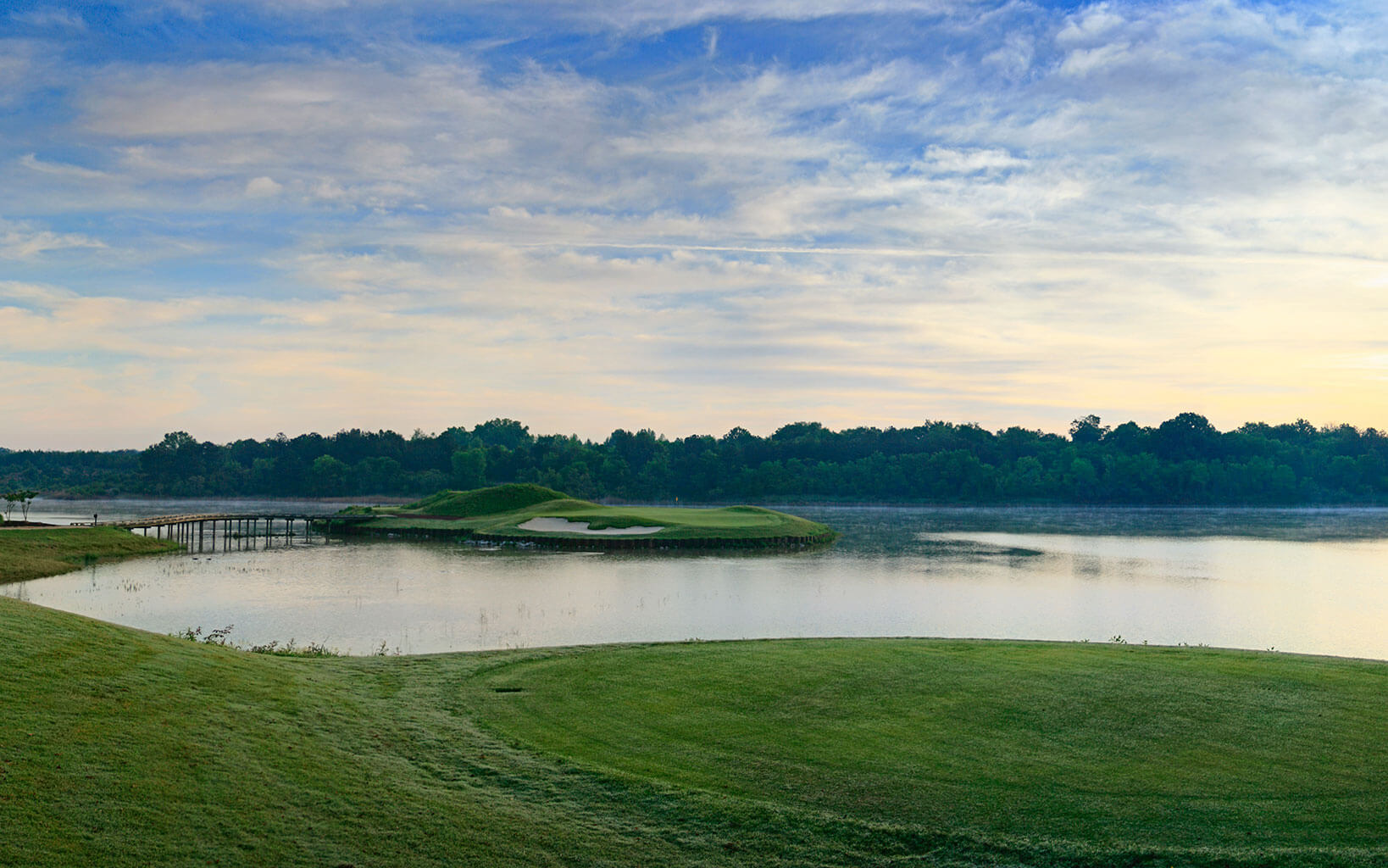 An island green awaits golfers on the sixth hole of the Judge Course