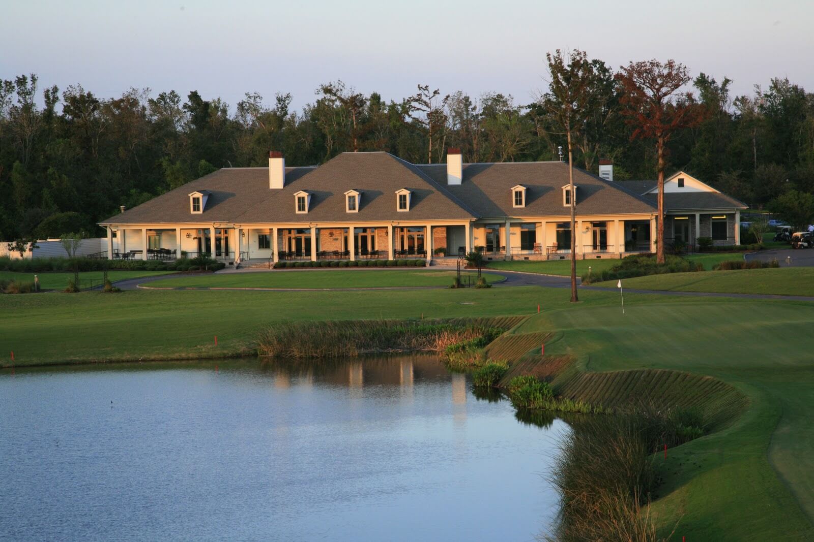 Overlooking a lake to the TPC Louisiana Clubhouse