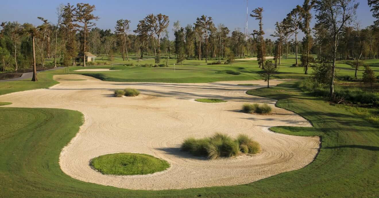 Large bunker covers most of the fourteenth fairway