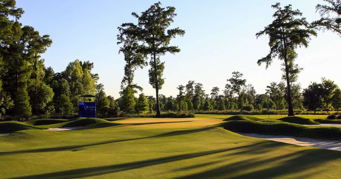 Large cypress trees overlook the second fairway