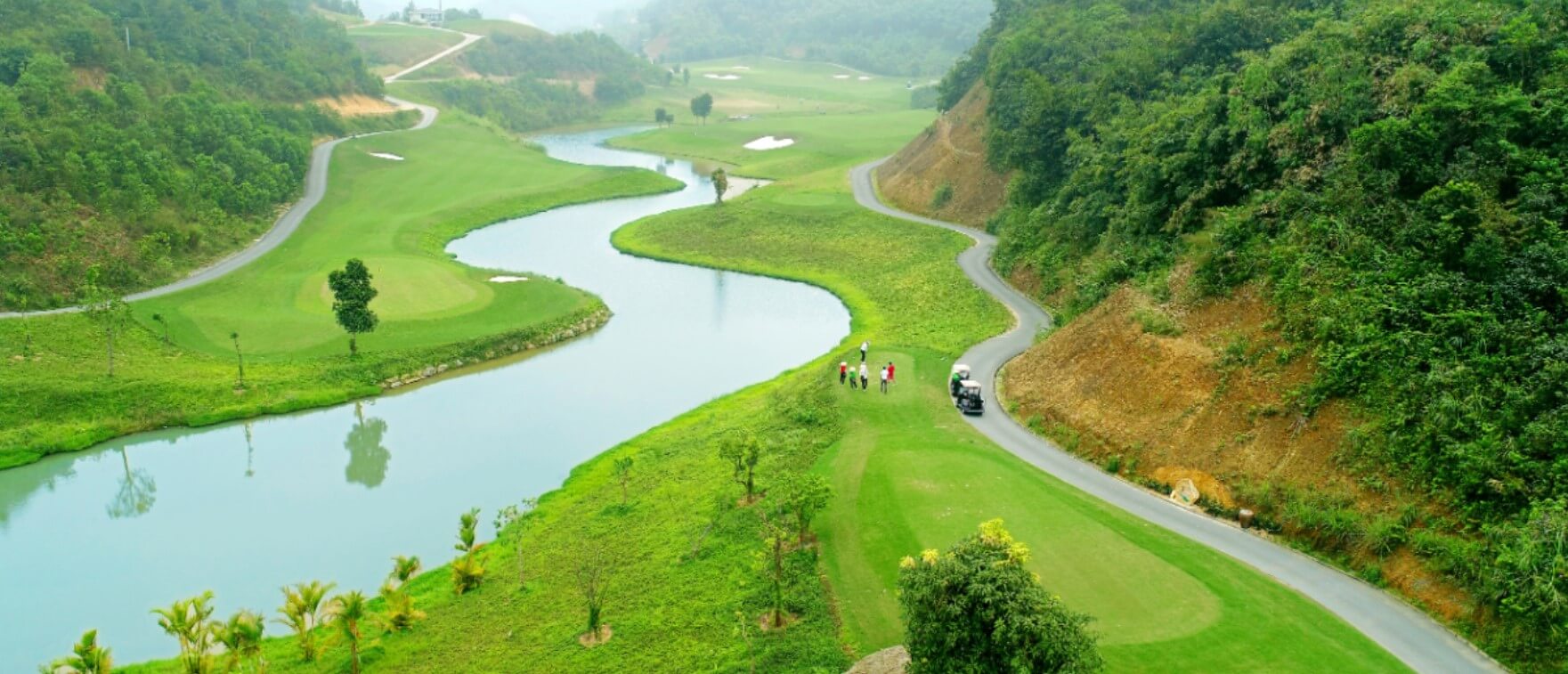 A wide river meanders through the course at Hilltop Valley