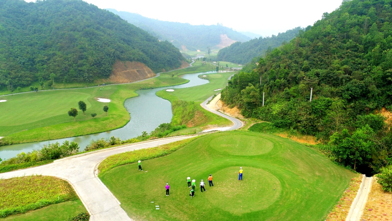 Aerial view of golfers teeing off