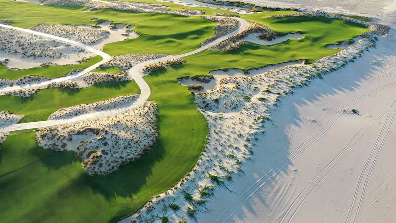 Aerial view of the golf course adjacent to the beach