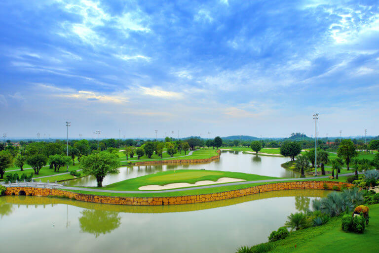 An island green i surrounded on all sides by a lake at Long Thanh