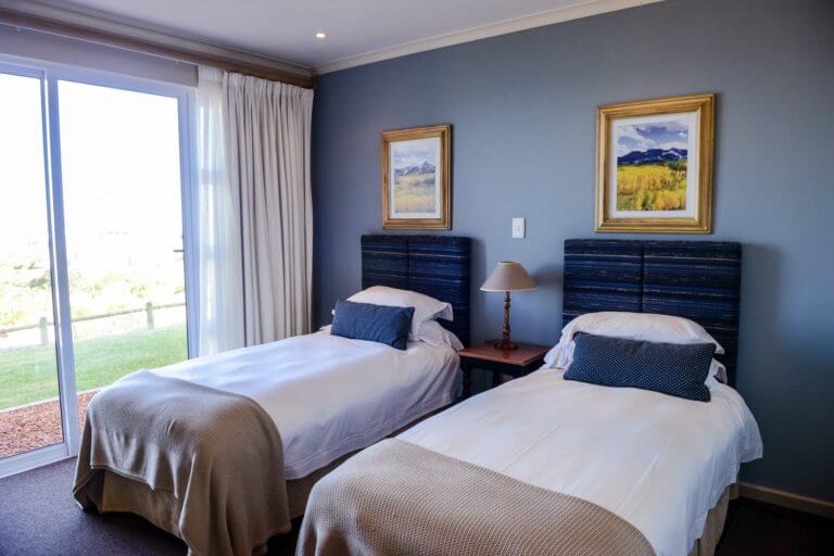 Twin beds adorn a bedroom perfect for golf groups