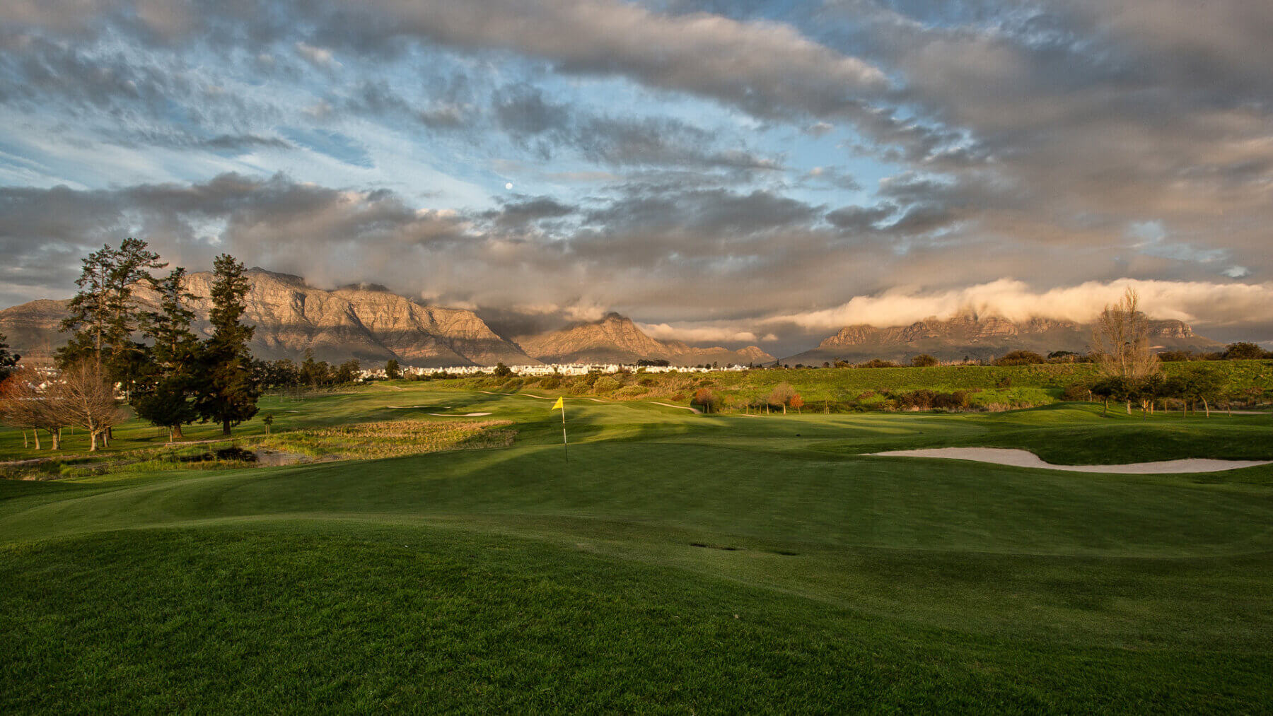 Setting sun casts golden light over the De Zalze golf course