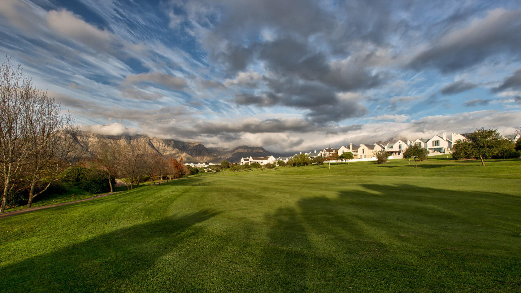 Residential houses stand next to the golf course at De Zalze Estate