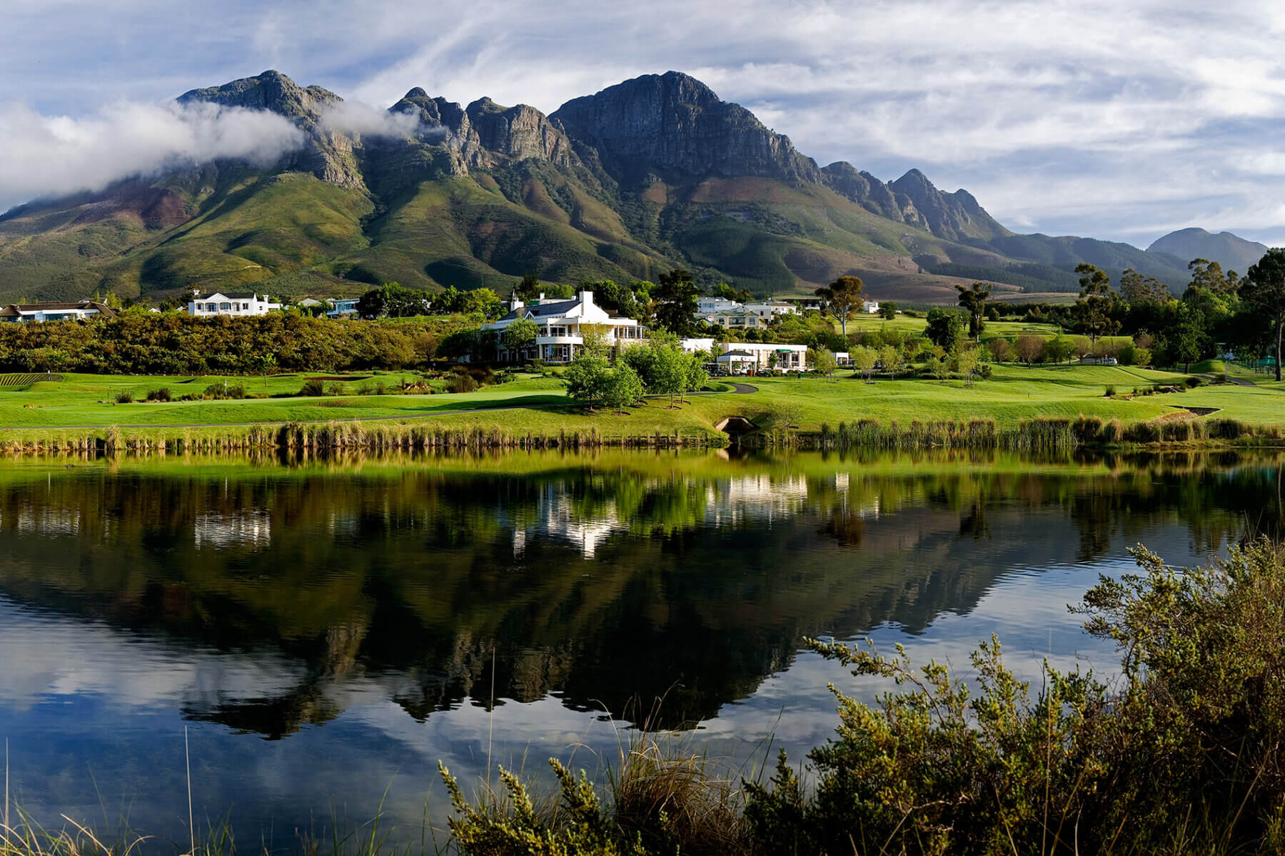 Overlooking a large lake in front of the Erinvale Estate