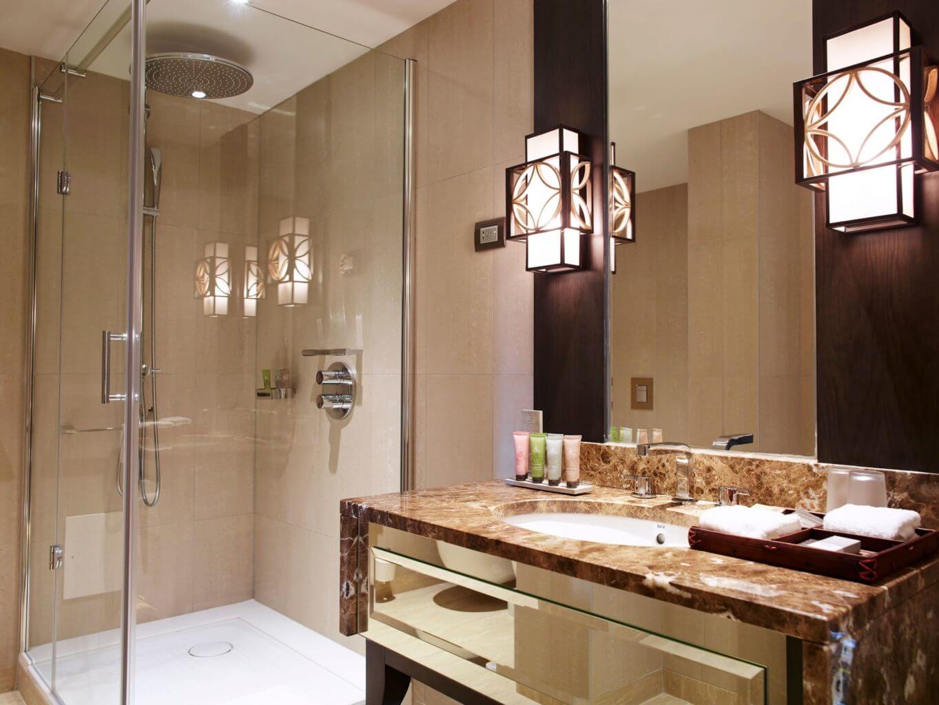 Elegant bathroom with walk-in shower at Dona Filipa Hotel