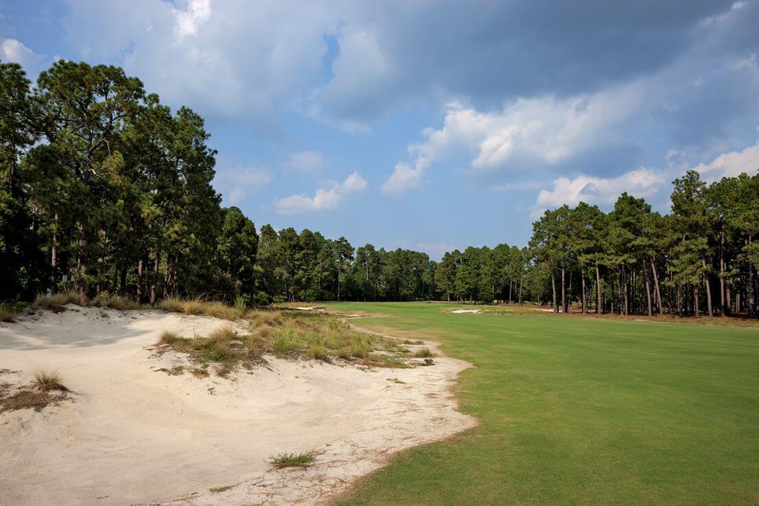 Large sand bunker flanks the second hole
