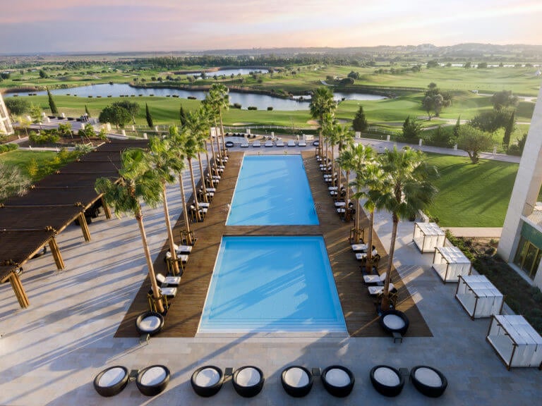 Two resort pools overlooking a golf course