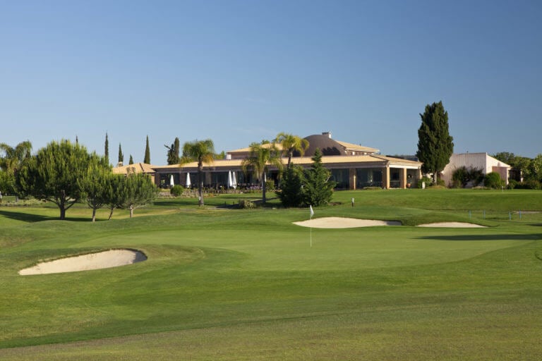 Dom Pedro's Millennium golf course clubhouse stands adjacent to the eighteenth green
