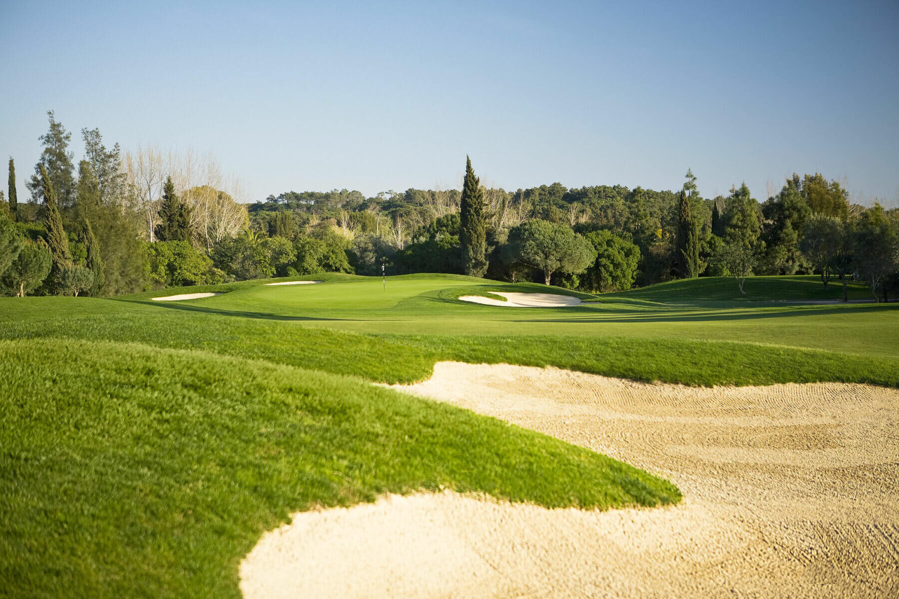 Large bunkers showcase the Millnnium golf course