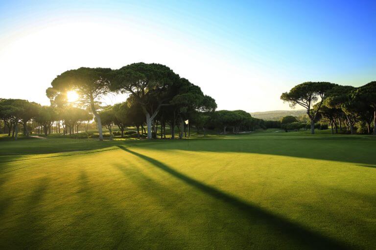 Sun casts long shadows over green at Dom Pedro Old Course