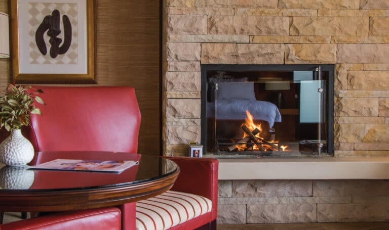 Log fireplace in a suite at Pezula Resort in South Africa