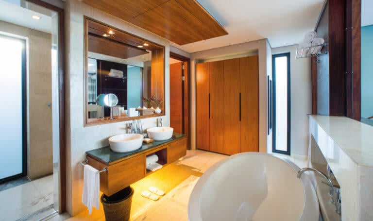 Large bathroom with contemporary lighting and furnishings