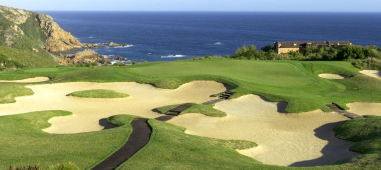 Signature fourteenth hole overlooking dramatic cliffs in South Africa's Pezula Resort